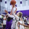 high school girls play basketball