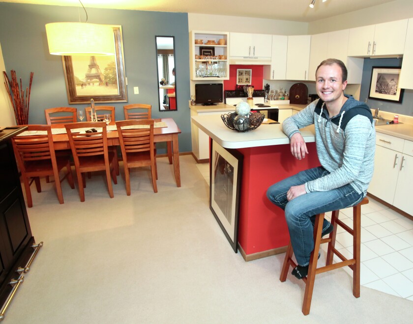 Jared Olson, 24, has been living in this apartment in Fargo for almost five years. It is near the motel where he works as a front desk agent. North Dakota has the nation's highest percentage of young adults who are living alone. Olson has been living on his own since he turned 18. Dave Wallis / The Forum