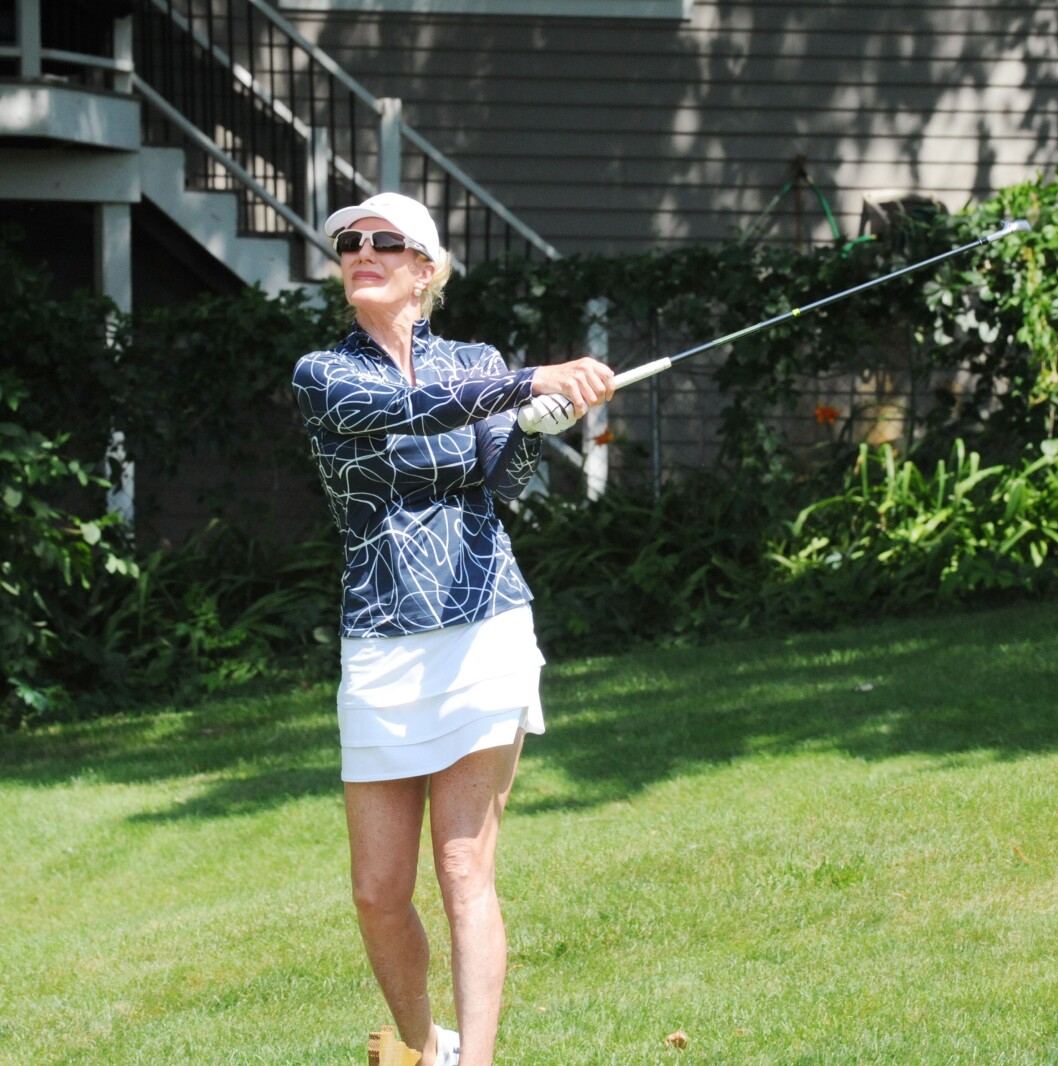 Jodi Sullivan launches her tee shot towards the Minnesota-shaped