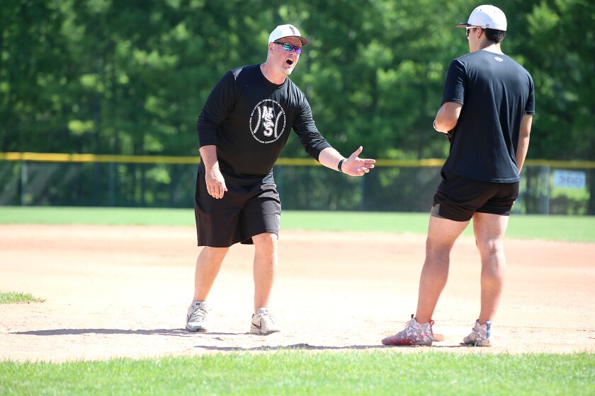 Coach talks with player.