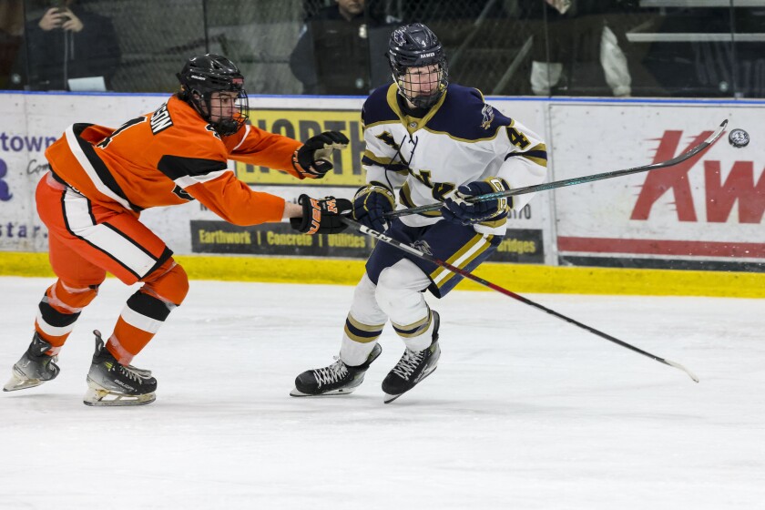 high school boys play ice hockey