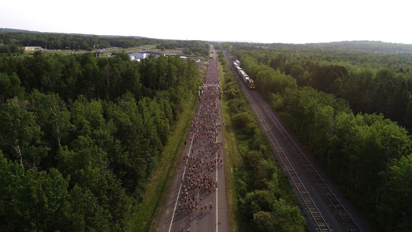 Aerial view of thousands of people running.