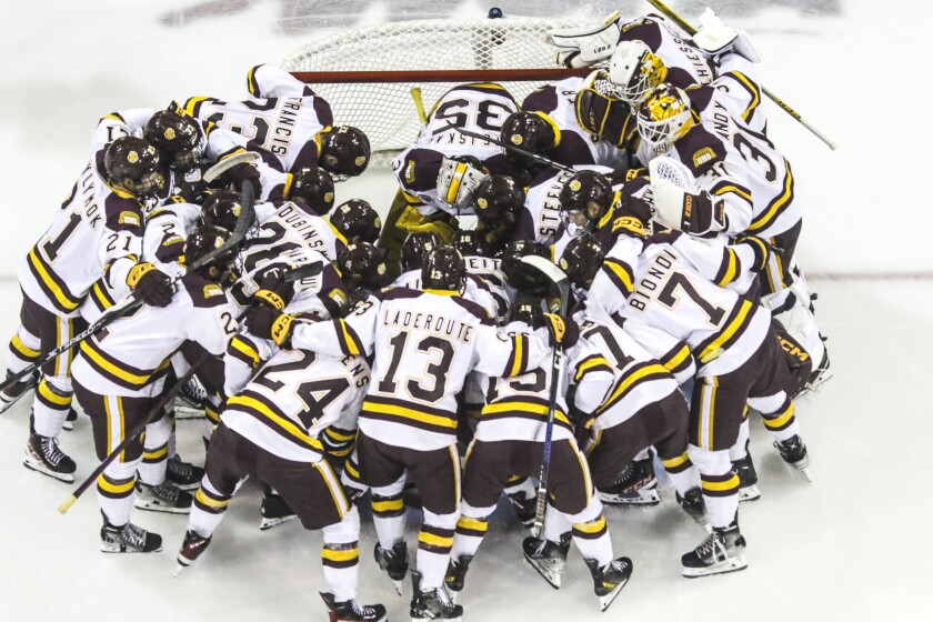 College hockey game in an indoor arena