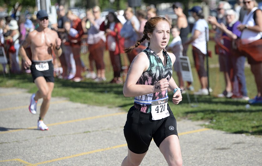 Morgan Bell, of Maple Grove, approaches the finish line at the end of the three-mile run at the Green Lake Triathlon on Sunday, Aug. 14, 2022 in Spicer.