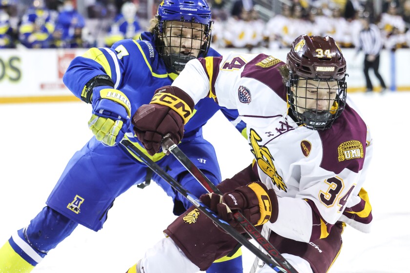 college men play ice hockey