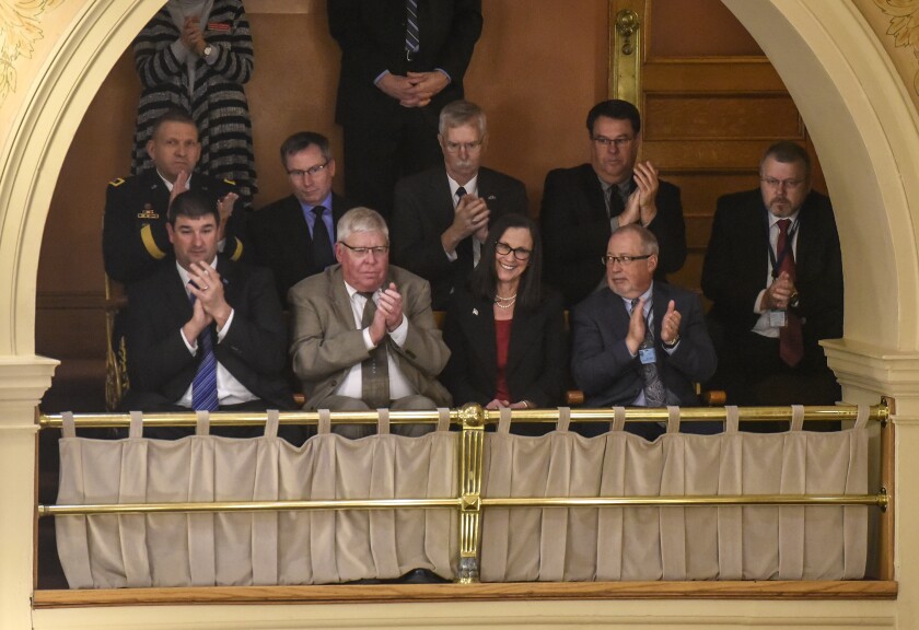 South Dakota Secretary of Agriculture Kim Vanneman, front row third from left, receives a round of applause after being singled out by Gov. Kristi Noem in the State of the State address on Tuesday at the State Capitol in Pierre. (Matt Gade / Republic)