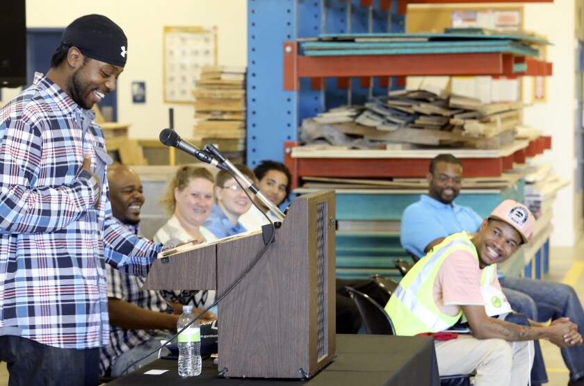 Harden Henry speaks during Thursday’s Soar Career Solutions graduation at the Carpenters and Joiners Training Center in Hermantown as fellow graduates Axon Walker, Rachel Wallace, Kiah Ahlberg, Isaac Newson, Danon Reives and Tavareous Williams listen. Steve Kuchera / skuchera@duluthnews.com