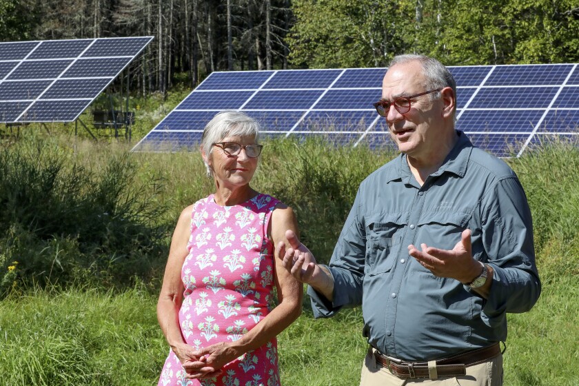 Homeowners Can Use Rebates, Tax Credits To Cut Emissions, But Does Technology Hold Up In Minnesota Winters? - The Bemidji Pioneer 82 Couple and their energy efficient house.