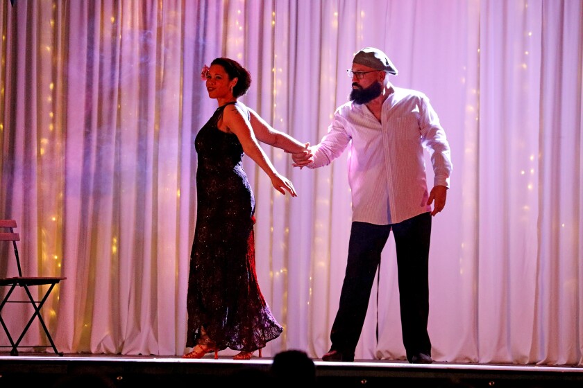 Dancer perform on stage.