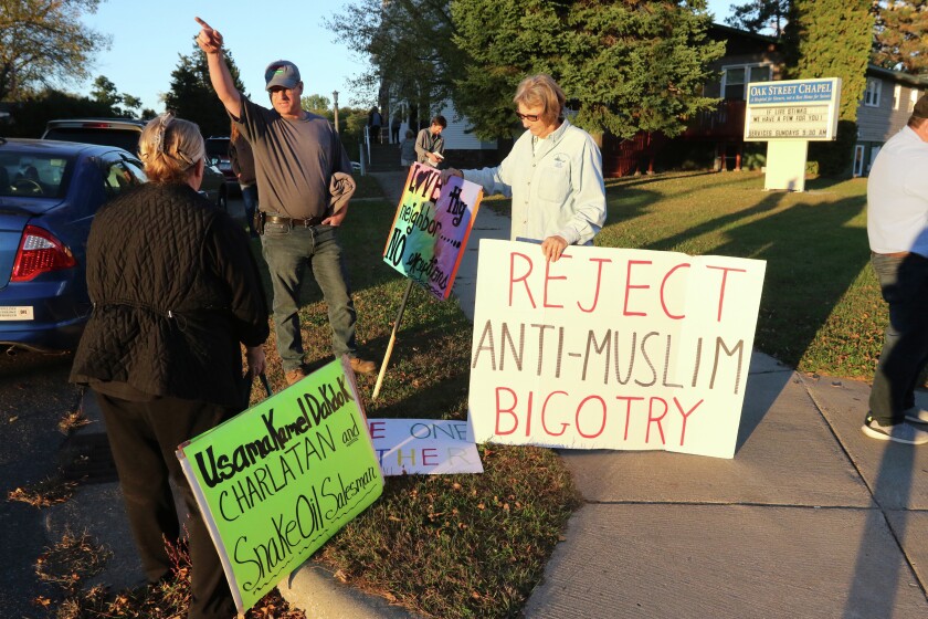 Outside the Oak Street Chapel before Usama Dakdok’s presentation there was an exchange between a handful of protesters and individuals attending the event Thursday in Brainerd. Kelly Humphrey/Brainerd Dispatch - Gallery and Video
