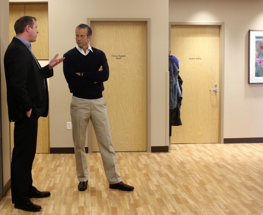 U.S. Sen. John Thune talks with Avera Clinic Manager Ryan Raml Friday in the dialysis unit of the Family Health Center. (Sara Bertsch / Republic)