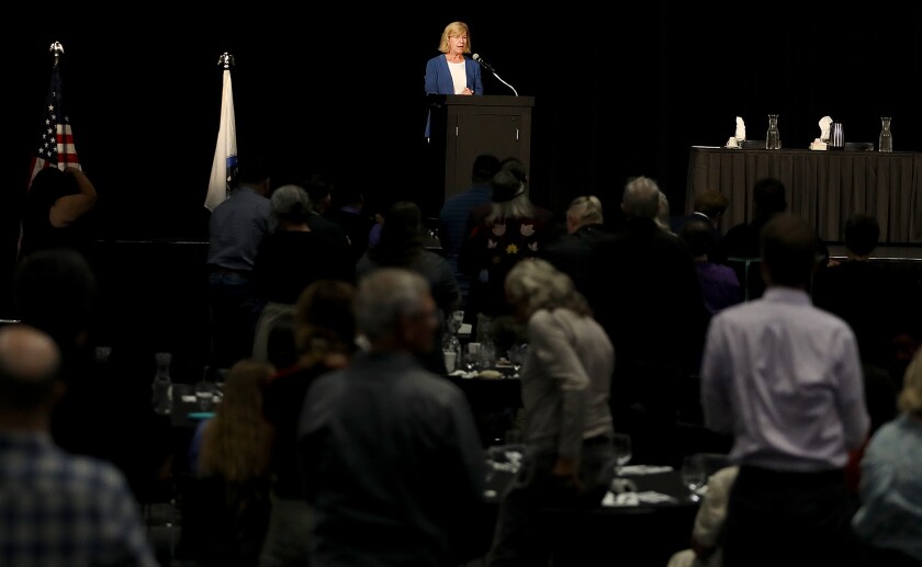 Wisconsin Sen. Tammy Baldwin receives a standing ovation during her speech at the Reclamation Ceremony