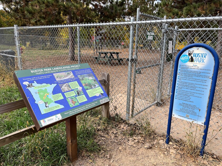 Buster Park entrance includes a posted sign about the park rules.
