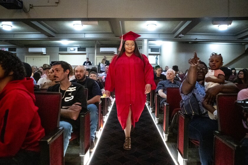 Area Learning Center senior Cassandra Duran walks in the processional during the school's senior graduation ceremony on Thursday, May 19, 2022, at the Willmar Education & Arts Center.