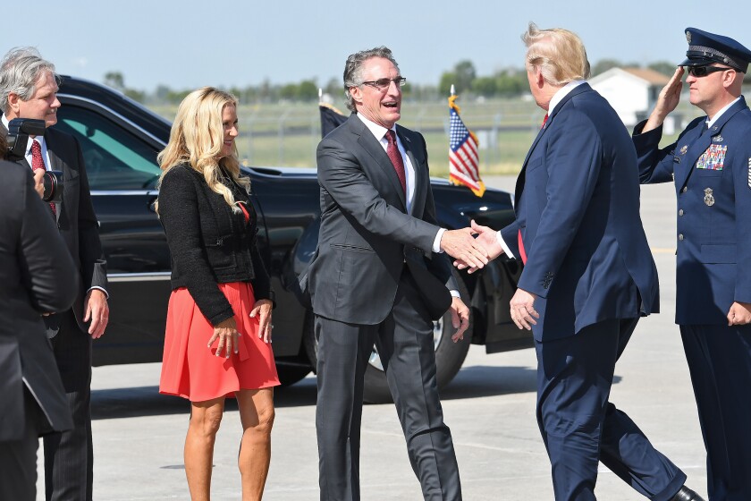 President Donald Trump greets members of the military and their families Friday, Sept. 7, at the North Dakota Air National Guard Base in Fargo. Michael Vosburg / Forum Photo Editor