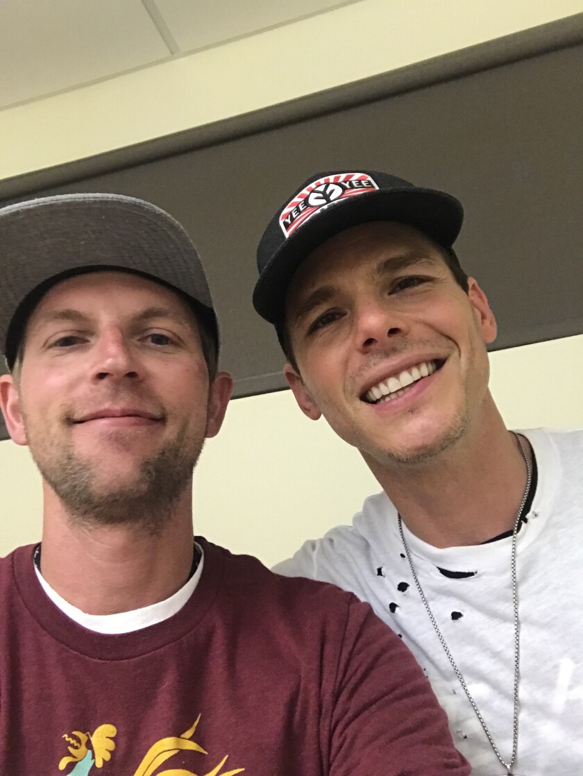 Ryan Kolquist poses with country artist Granger Smith.