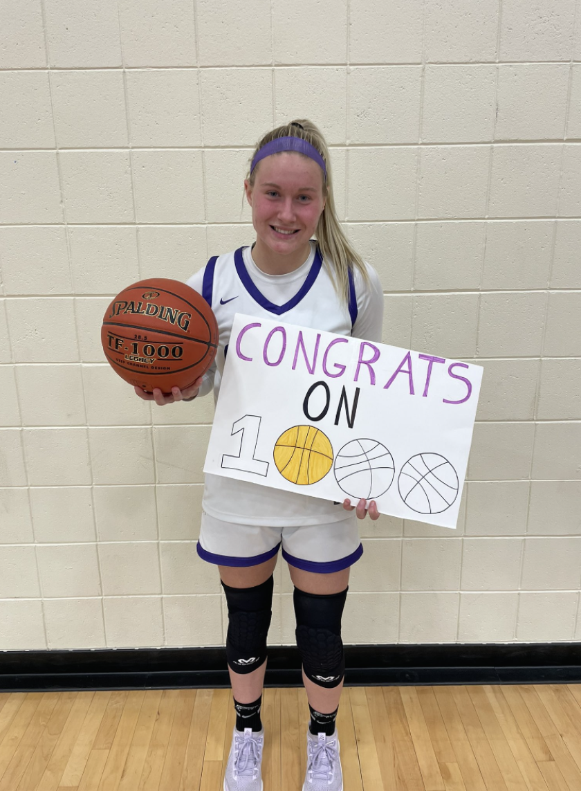 Maddie Young holds game ball