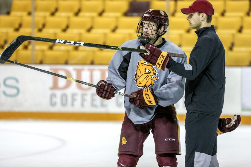 Minnesota Duluth men's hockey assistant coach Adam Krause works with Tanner Laderoute Wednesday during team practice at Amsoil Arena in Duluth. Clint Austin / caustin@duluthnews.com