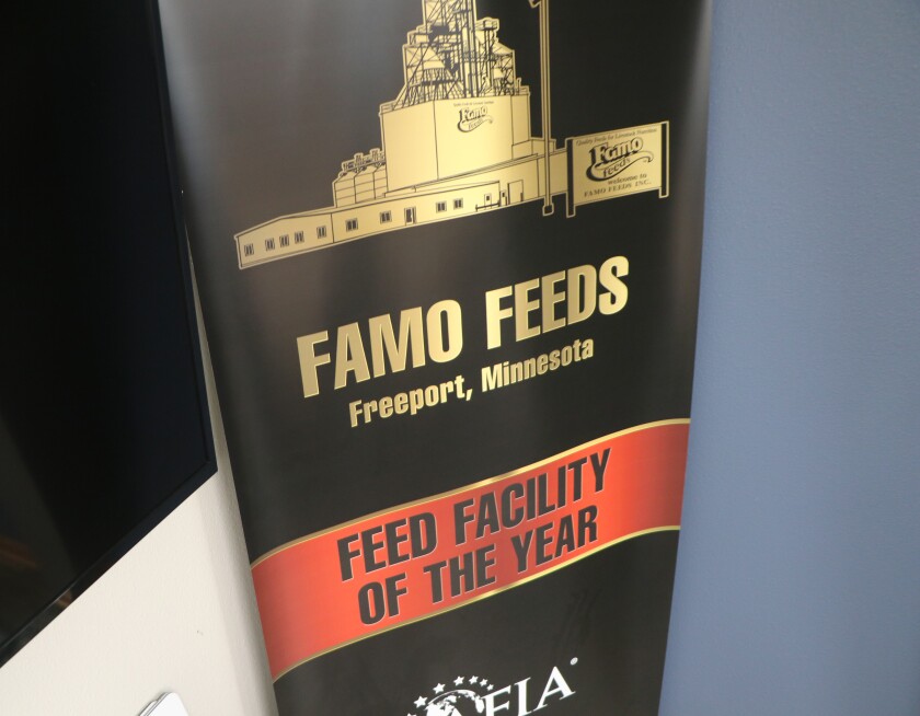 A banner for a national industry award stands in the Famo Feeds conference room.