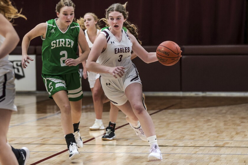 high school girls playing basketball