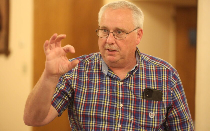 Eric Shaffer, chief engineer for the Duluth water and gas departments, holds up fingers