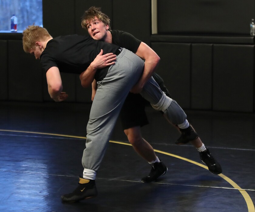 Northwestern wrestler Tanner Kaufman spars during practice at NHS