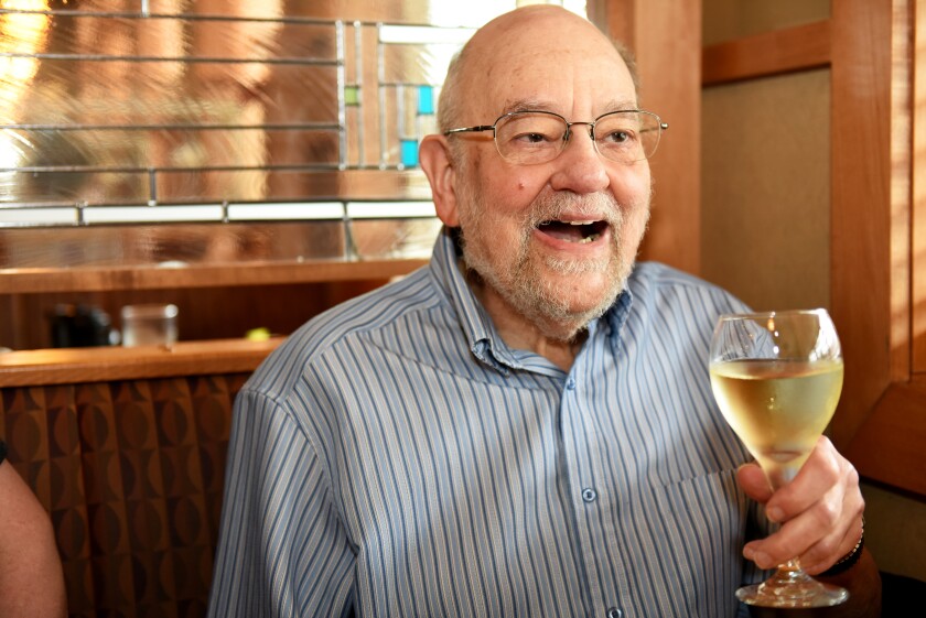 Former Central Lakes College Instructor Joe Plut, known as the "Mad Hugger" drinks a glass of wine at Prairie Bay in Baxter during a 2016 Brainerd Dispatch interview. Plut passed away Thursday, Jan. 17. Brainerd Dispatch file photo