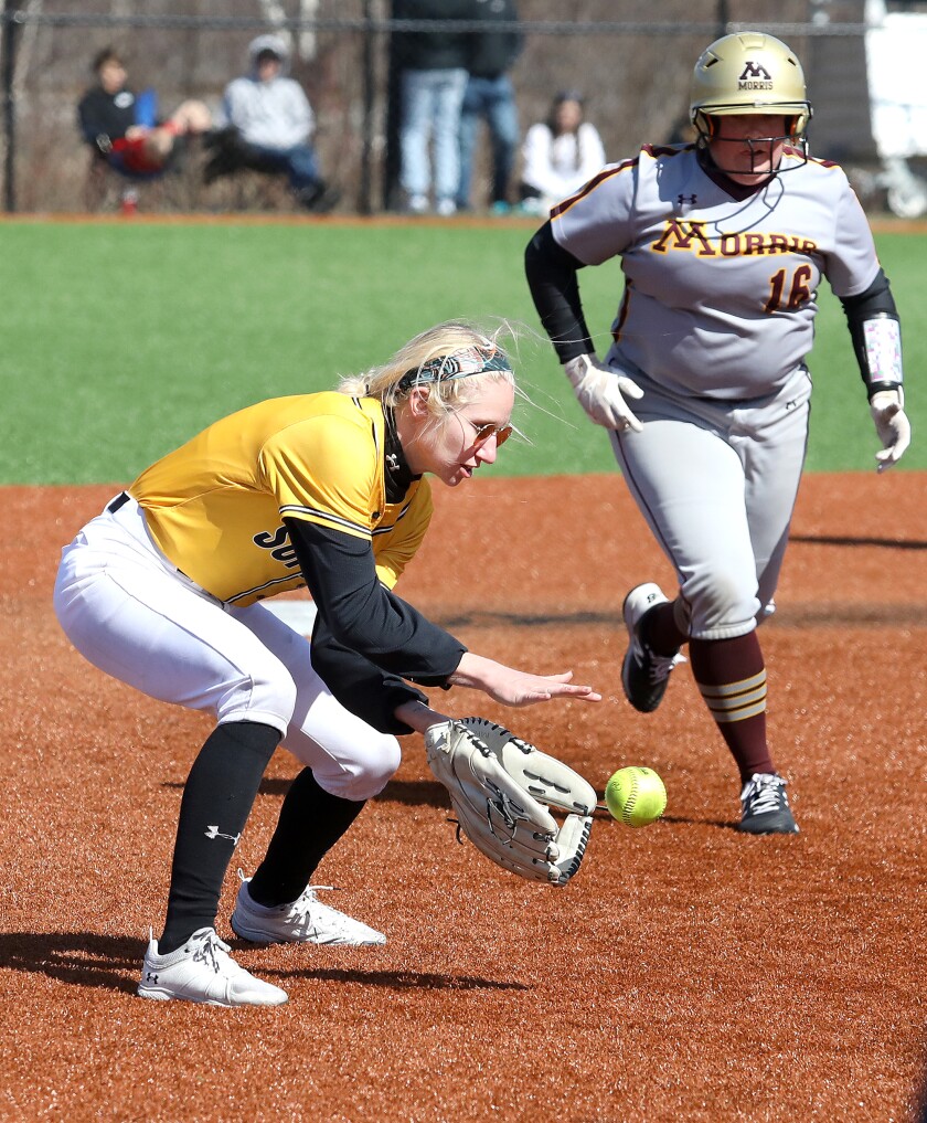 UW-Superior’s Kaela Kraemer (8) fields a ball at shortstop in front of Minnesota Morris’ Olivia Diver (16)