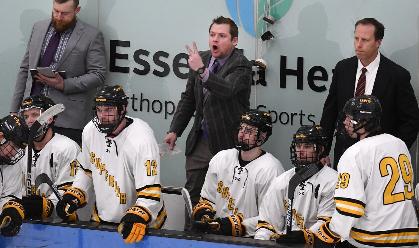 UW-Superior head coach Rich McKenna, center, lets the referees know of his displeasure