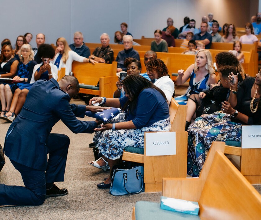 Pastor Henry presenting flag to mother at retirement installation serving, July 2021, Calvary Church.jpg