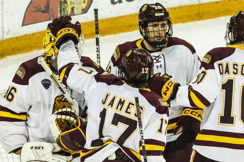college men play hockey