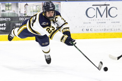 high school boys play ice hockey