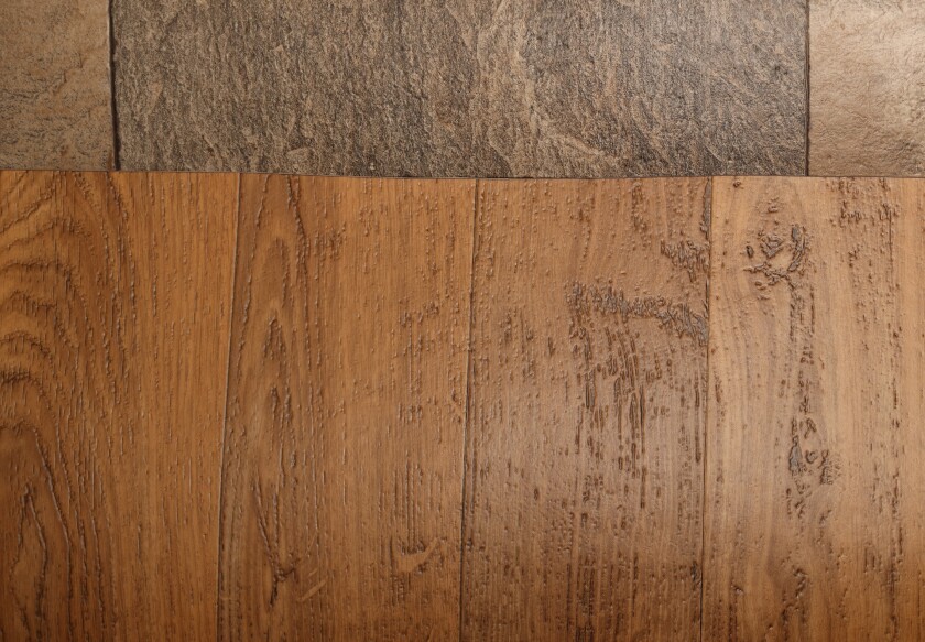 Vinyl sheet floor coverings remain popular and can be found in faux stone and faux wood finishes, as shown here at Rune's Furniture.