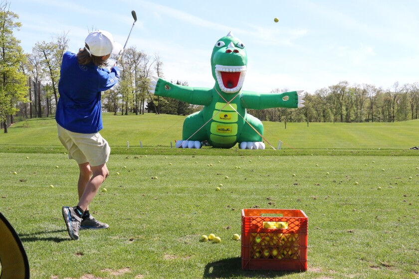 Jack Hagberg hits a ball toward a giant inflatable reptile “Golfzilla” Saturday during Golf-A-Palooza at Cragun’s Legacy practice facility. The event, with the goal to get area youths interested in the game of golf, was hosted by area golf courses, the Classic at Madden’s, Grand View Lodge, Crosswoods Golf Course and Cragun’s Legacy Courses with the help of the Minnesota Golf Association and the Minnesota Section of the Professional Golfer’s Association. Kelly Humphrey / Brainerd Dispatch - Gallery