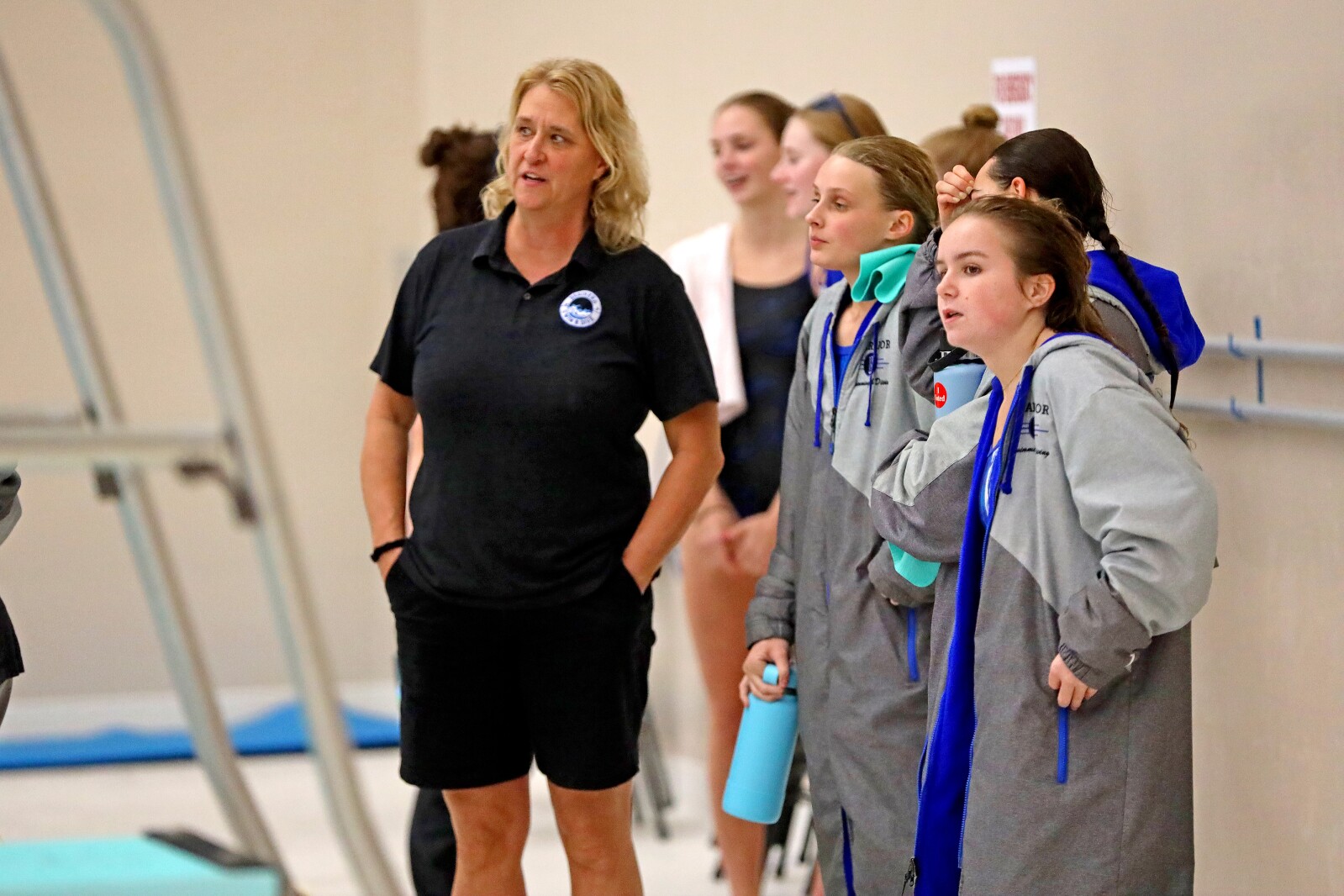 Diving coach talks with divers.