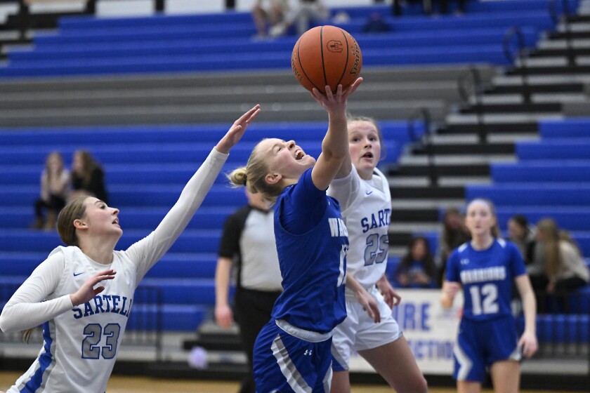 Warrior girls playing basketball.