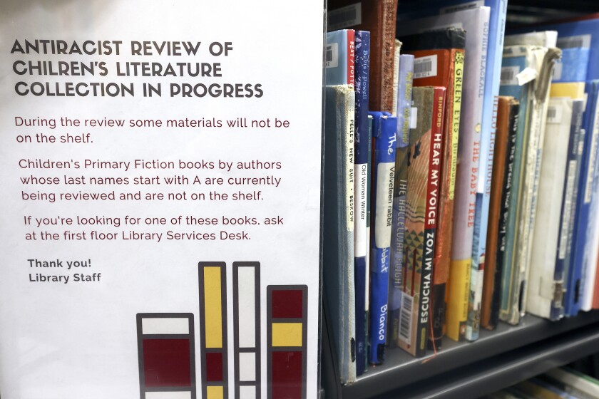 Sign by books.