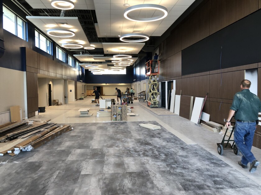 Workers were finishing work in the public area leading to the gymnasium and kitchen in the new MACCRAY central campus in Clara City as this photo was taken on August 30. The district will welcome students to the new school facilities on Wednesday.