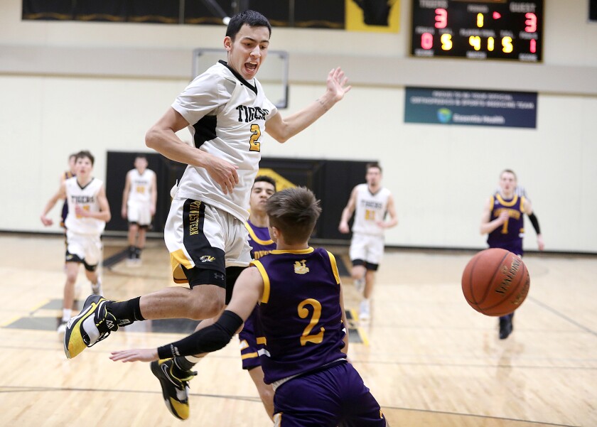 Northwestern’s Monte Mayberry (2) gets fouled by Ladysmith’s Brady Ingersoll (2)
