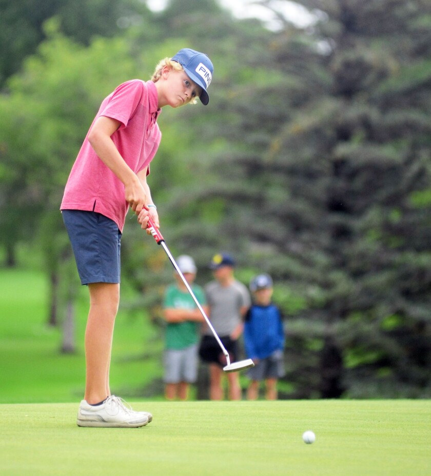 Garrison Johnson putts on the No. 11 green during his Junior 10-