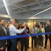 95b509-20250203-a-group-of-people-smile-and-cut-a-ribbon-webp1400.jpg
