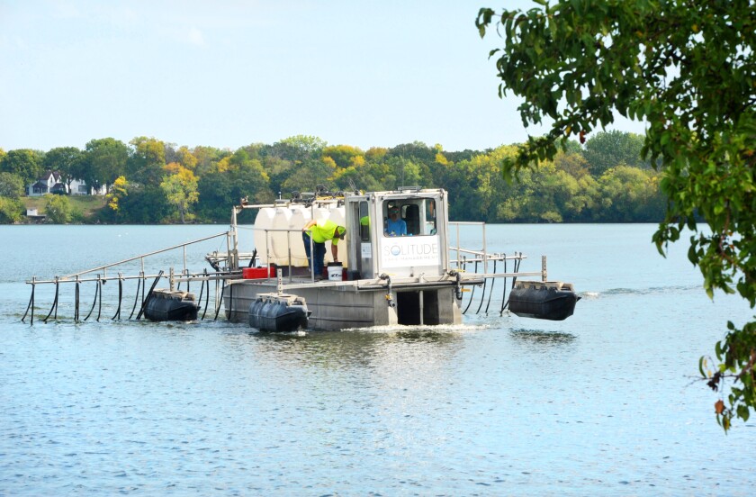 Pontoon treating Lake Agnes with alum