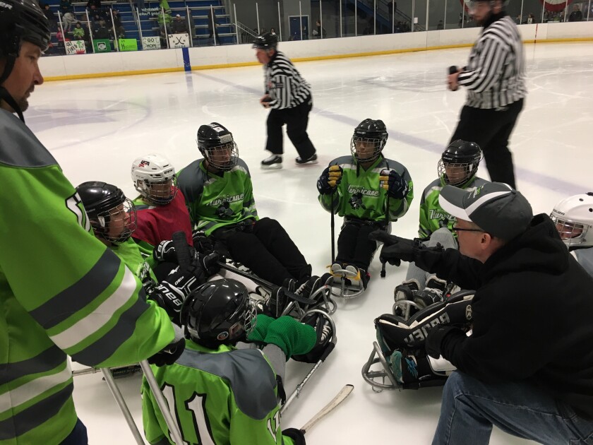 HOPE Inc. Hurricanes' Tyler Shepersky plays the puck in the USA Disabled Hockey Festival in West Dundee, Ill., last weekend. Submitted photo