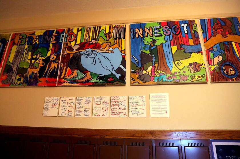 A Brainerd-themed mural hangs above lockers