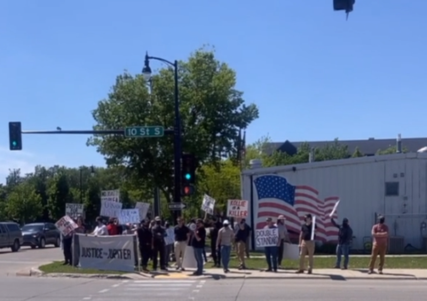 Michael 'Enoch' Peinovich, chairman of the National Justice Party, in Fargo with local white activist Pete Tefft and about 20 or more others on June 4, 2022, protesting what they considered double standards in the Arthur Kollie murder case.