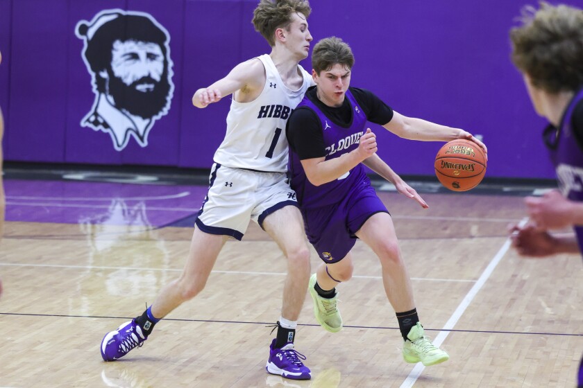 high school boys play basketball