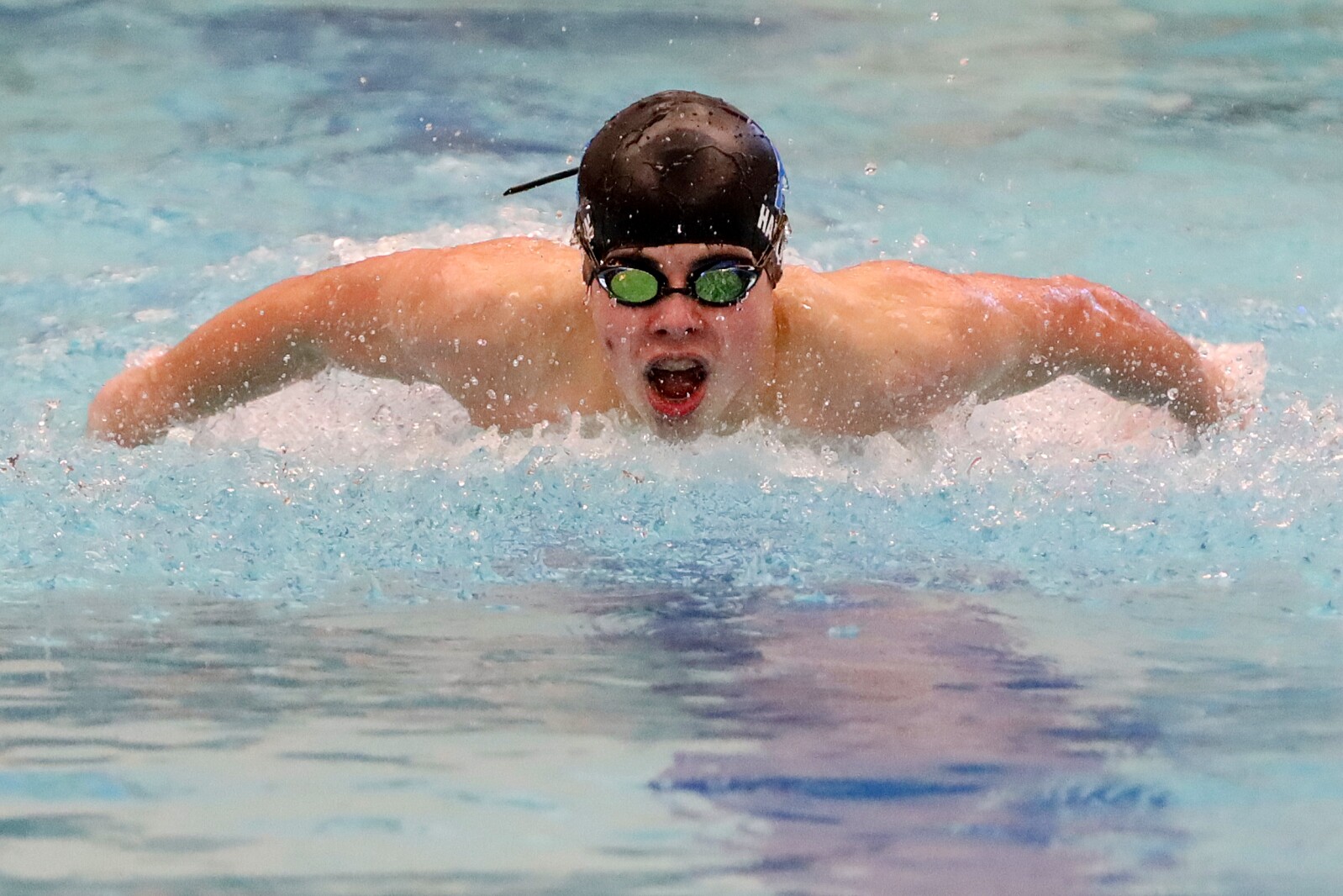 Swimmer in the pool competing.