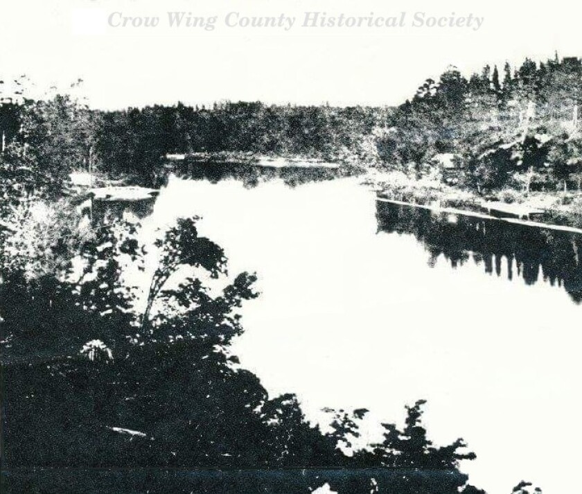 A black and white image of a ferry crossing circa 1870.