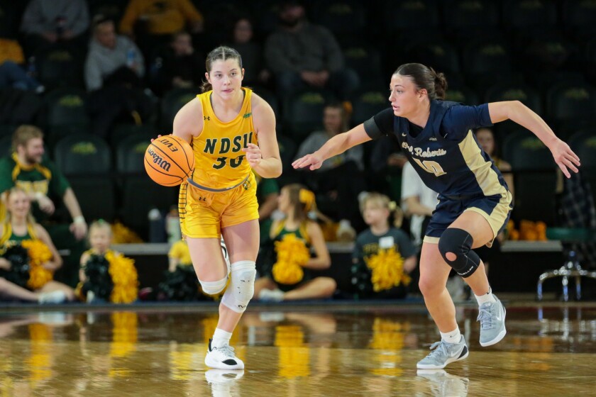 North Dakota State's Jocelyn Schiller brings the ball up the court, defended by Oral Roberts player Preslee Hartsock on Saturday, Jan. 31, 2026, at the Scheels Center.