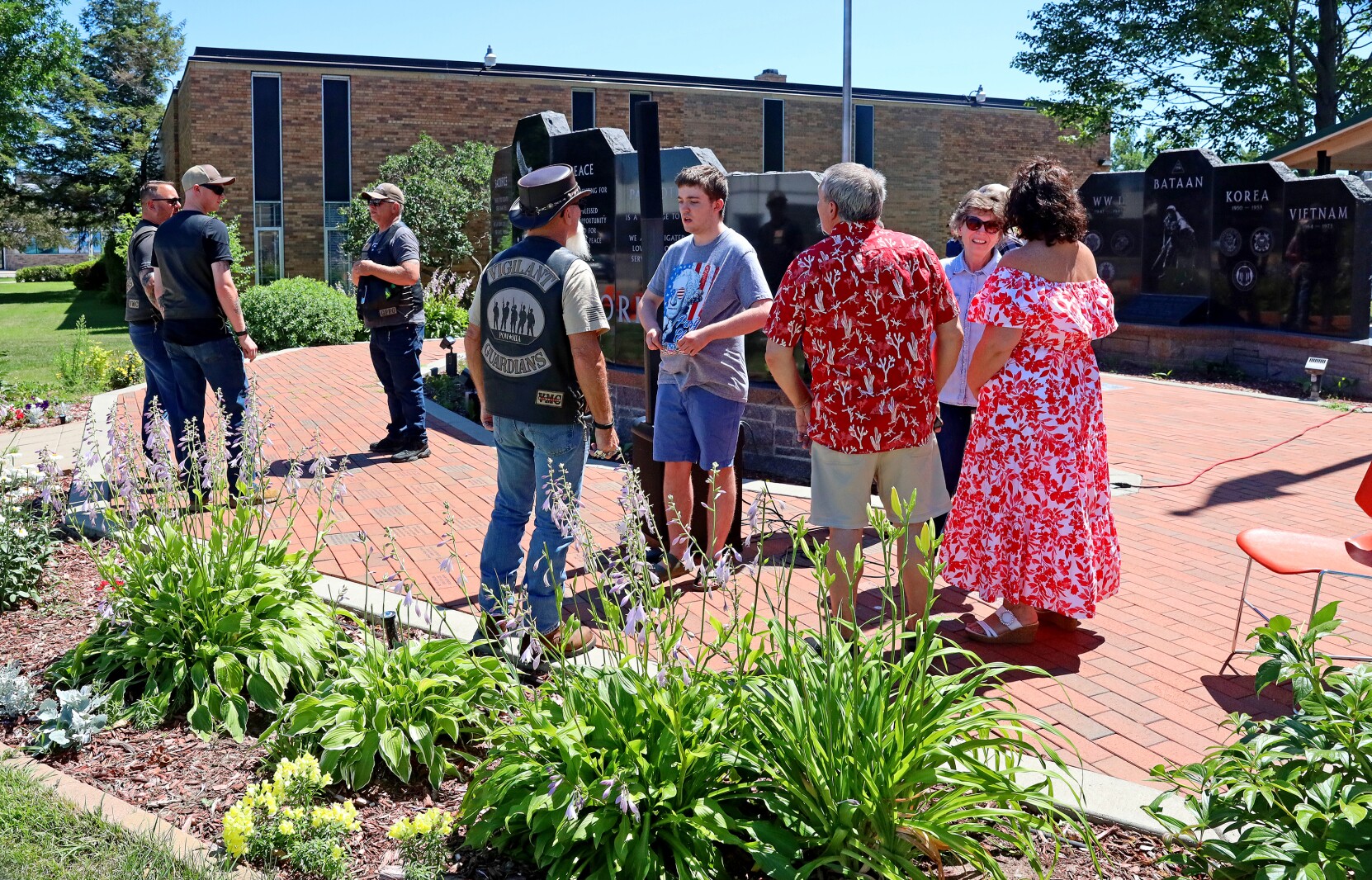 People attend the Armed Forces Veterans Tribute Day